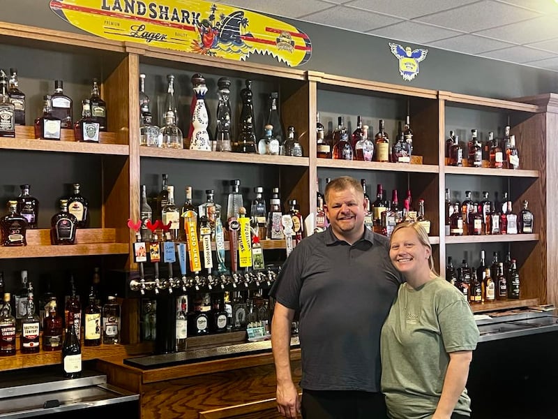 Brick Boss and Tonya Smith stand behind the bar of their new restaurant, Dunk's Bar & Grill in Dixon on July 21, 2025.