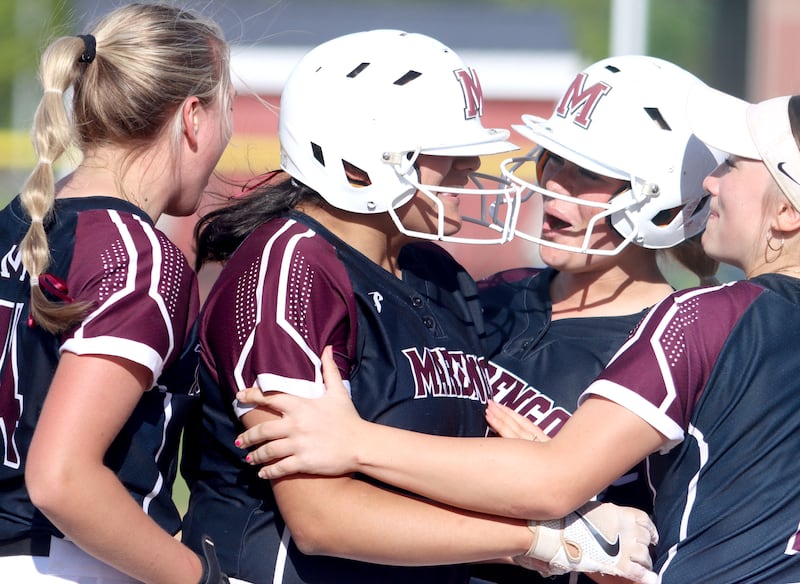 Marengo’s Arianna Rodriguez is greeted at home plate on a home run against Aurora Central Catholic in IHSA Class 2A Regional Title Game action softball at Marengo High School in Marengo on Friday, May 23, 2025.