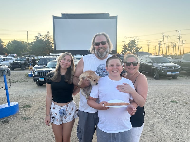 Regnas family members (from left) Lily, Gabe, Jackson and Kristi enjoyed a recent evening at the McHenry Outdoor Theater with their pooch, Ryder. While well-behaved, leashed dogs are always welcome, a special Bring Your Dog to the Movies event is set for Aug. 22-23.