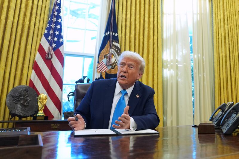 FILE - President Donald Trump speaks to reporters as he signs executive orders in the White House, Feb. 4, 2025, in Washington. (AP Photo/Evan Vucci, File)