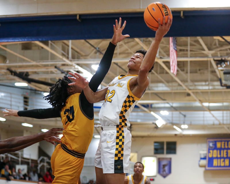 Joliet West's Ethan Hillsman (32) shoots over the defense during their Class 4A Regional match up basketball game between Joliet West vs Thornwood. Feb 26, 2025 in Joliet.