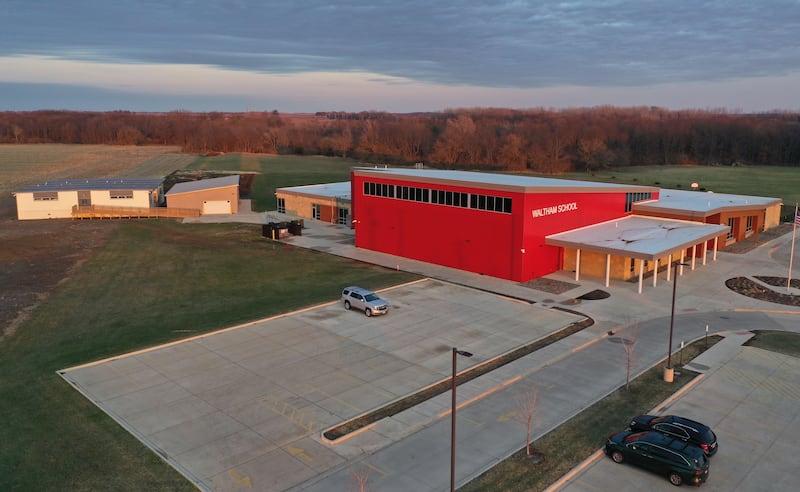 An aerial view of Waltham School on Thursday, March 27, 2025 in Utica. The area where the mobile classrooms are is the proposed expansion for the school if the referendum passes on Election day.