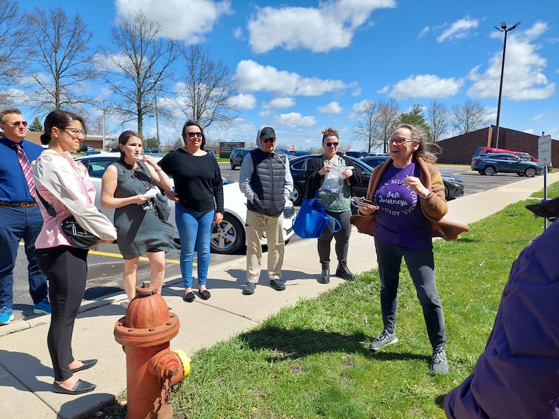 Susan Bursztynsky, the executive director of Safe Journeys, talks about advocating for victims of sexual and domestic violence on Friday, April 12, 2024, during a rally in front of the La Salle County Courthouse on Etna Road in Ottawa.