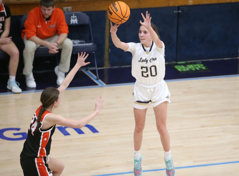 Marquette's Kaitlyn Davis shoots a jump shot over Roanoke-Benson's Josie Weber on Thursday, Feb. 6, 2025 in Bader Gym at Marquette High School.