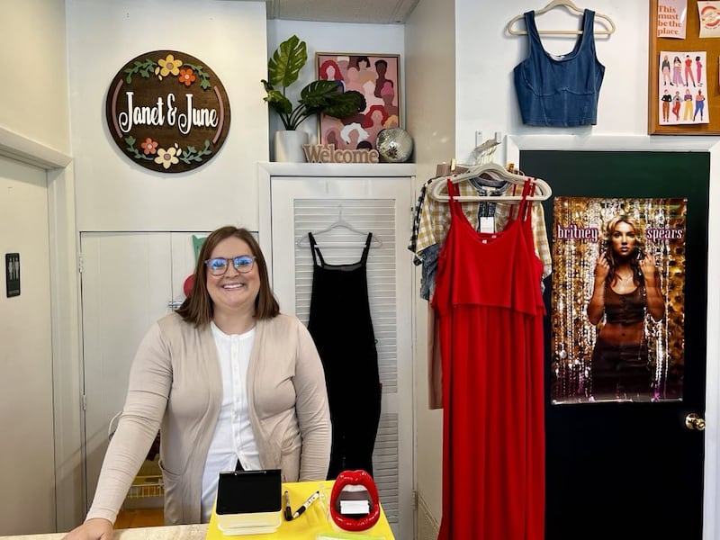 Sarah Bohm stands ready to greet customers at her boutique clothing store, Janet & June, in Dixon, Illinois.