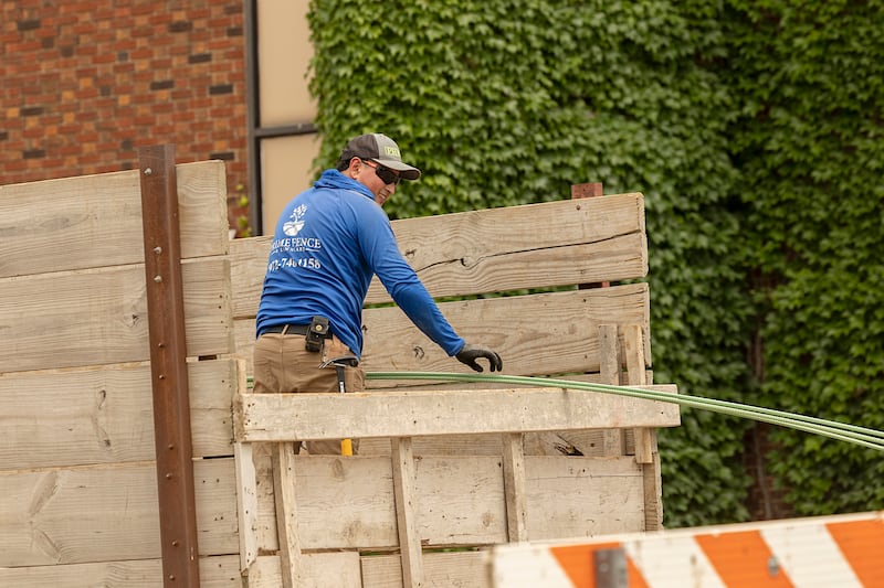 Workers unload gear for the reconstruction of the crosswalks at Peoria Avenue and West Second Street in Dixon on Tuesday, June 9, 2026.