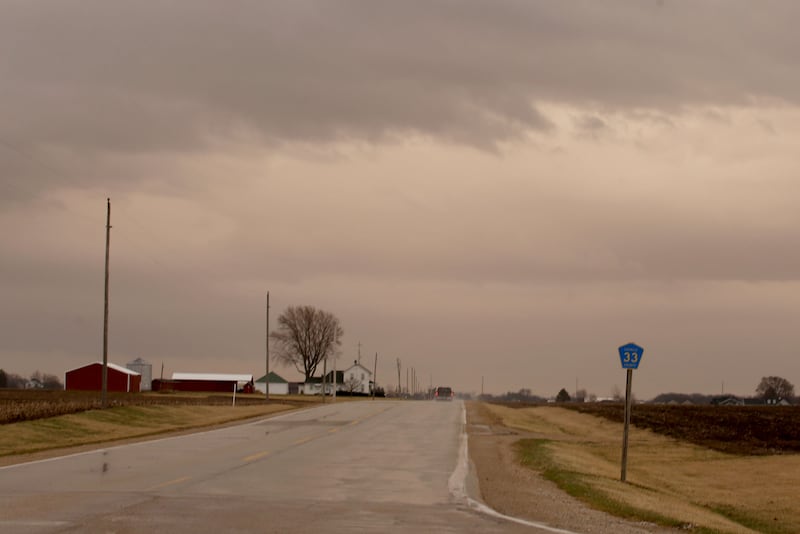 A view of a sepia colored sky next to a barn on Illinois Route 251 on  Wednesday, March 19, 2025 in Peru. "Dirty rain," or "muddy rain" caused by wind and smoke from the plain states traveled into the Illinois Valley on Wednesday. Airborne particles of that smoke and dust ended up getting caught in the air and fell as raindrops to the surface.