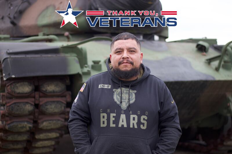 U.S. Army veteran Jose Guzman, the commander of Stone City VFW Post 2199, stands by a tank outside the building for the organization on Oct. 22, 2025.