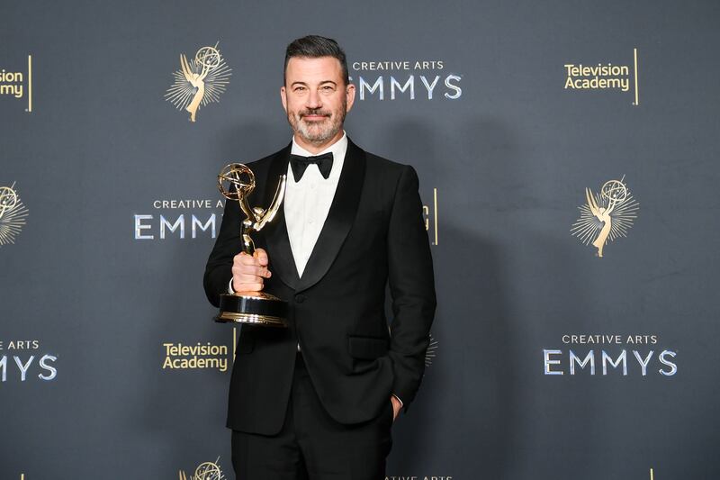 Jimmy Kimmel poses in the press room with the award for host for a game show for "Who Wants to Be a Millionaire" during night two of the Creative Arts Emmy Awards on Sunday, Sept. 7, 2025, at the Peacock Theater in Los Angeles. (Photo by Richard Shotwell/Invision/AP)