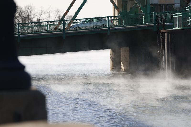 Steam rises off the Des Plaines River below the Jefferson Street Bridge as temperatures drop below zero on Friday, Jan 23, 2026 in Joliet.
