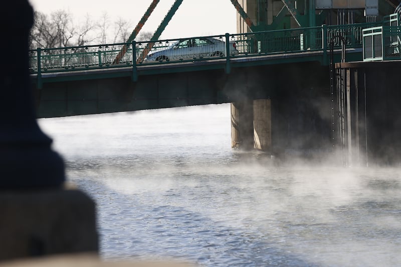 Steam rises off the Des Plaines River below the Jefferson Street Bridge as temperatures drop below zero on Friday, Jan 23, 2026 in Joliet.