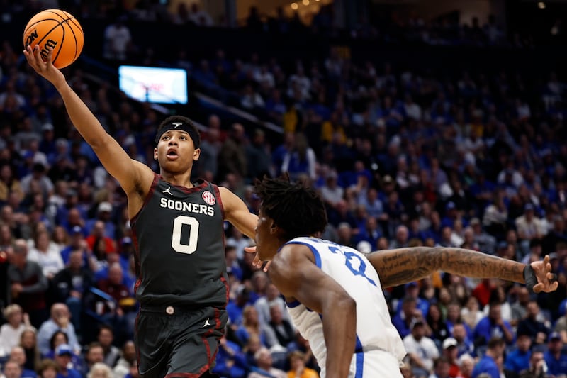 Oklahoma guard Jeremiah Fears (0) shoots against Kentucky center Amari Williams (22) during the first half of an NCAA college basketball game in the second round of the Southeastern Conference tournament, Thursday, March 13, 2025, in Nashville, Tenn. (AP Photo/Wade Payne)