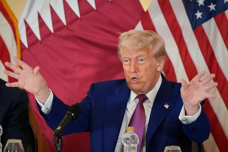 President Donald Trump gestures during a business roundtable, Thursday, May 15, 2025, in Doha, Qatar. (AP Photo/Alex Brandon)