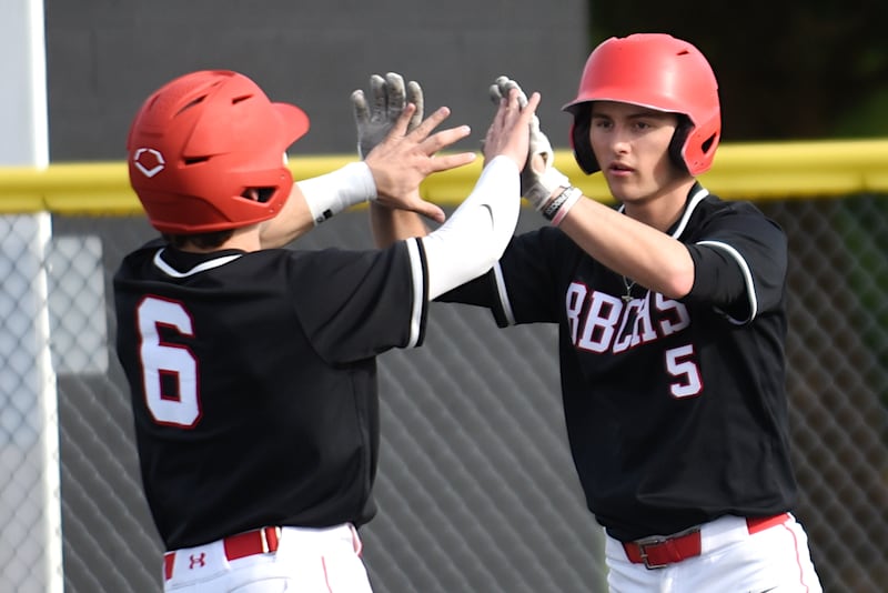 Bradley-Bourbonnais' Jace Boudreau, right, congratulates Clark Six on scoring a run during a game at Herscher Friday, April 24, 2026.
