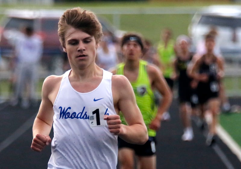 Woodstock’s Ellery Shutt cruises to victory in the 3200 meter run during the Kishwaukee River Conference Boys Track and Field Meet on Tuesday, May 12, 2026, at Johnsburg High School.