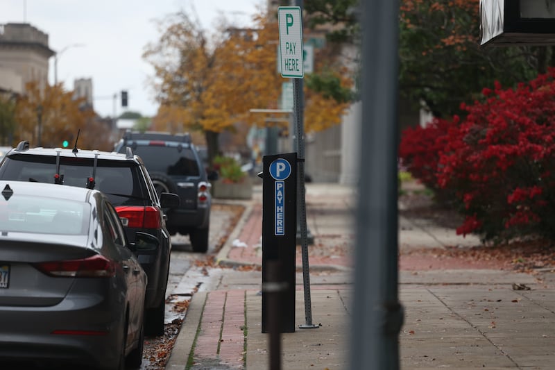 A parking kiosk sits along West Clinton Street in Downtown Joliet on Wednesday, Oct. 25, 2023.