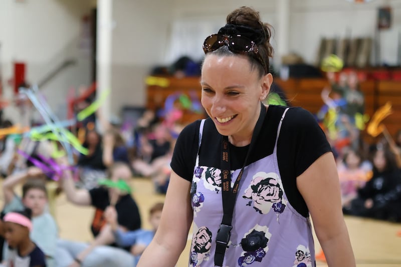 Ashley Carlson, fifth grade teacher at Malta Elementary School in DeKalb, reacts as she's announced as the 2026 Wirtz Award winner for excellence in education during a surprise school assembly on April 24, 2026.