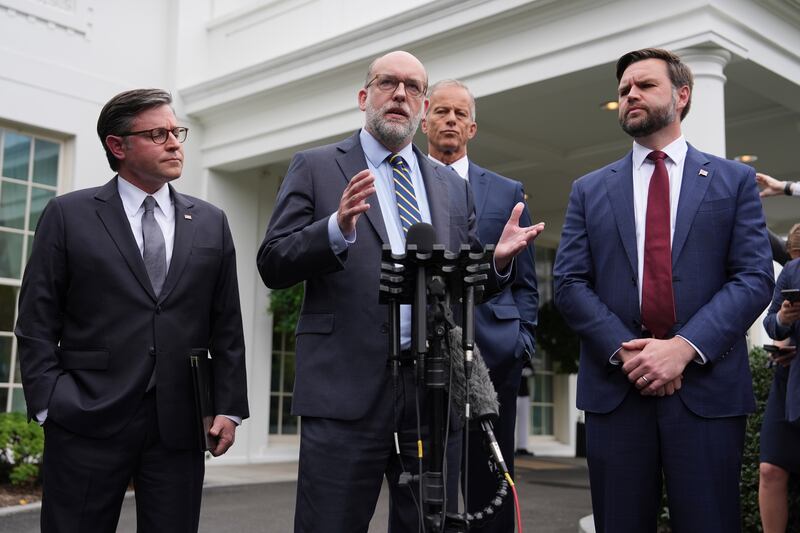 Russell Vought, Office of Management and Budget director, speaks alongside House Speaker Mike Johnson, R-La., from left, Senate Majority Leader John Thune, R-S.D., and Vice President JD Vance as they address members of the media outside the West Wing at the White House in Washington, Monday, Sept. 29, 2025, in Washington. (AP Photo/Evan Vucci)