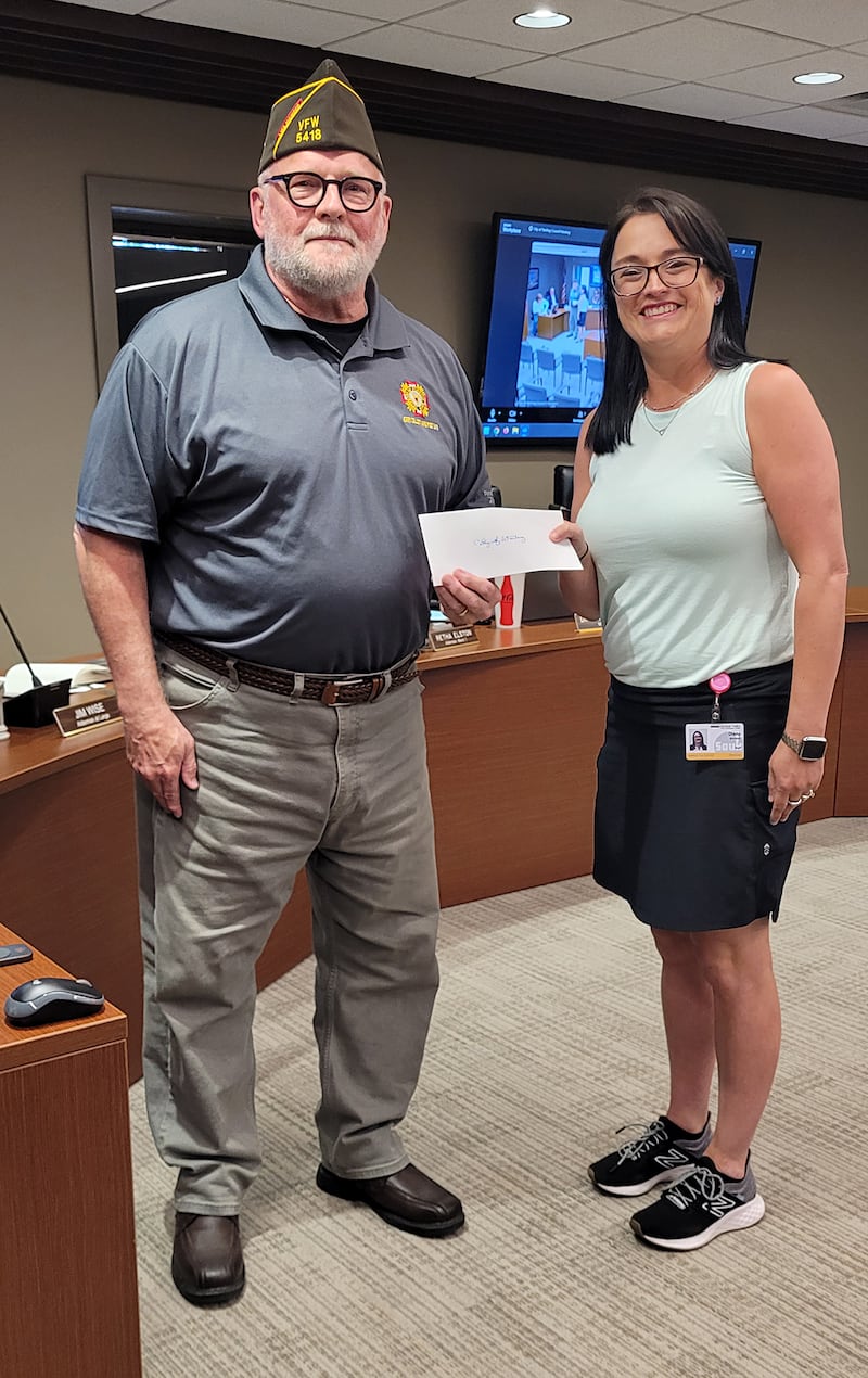 At the May 18 Sterling City Council meeting, Jim Wise, Sterling alderman at large, put on his hat as a member of the Rock Falls VFW Post 5418 to present Sterling Mayor Diana Merdian with a check for $12,500 for a veterans memorial at the Northwestern Steel and Wire Park. Wise was representing Post Commander Jerry Celletti.