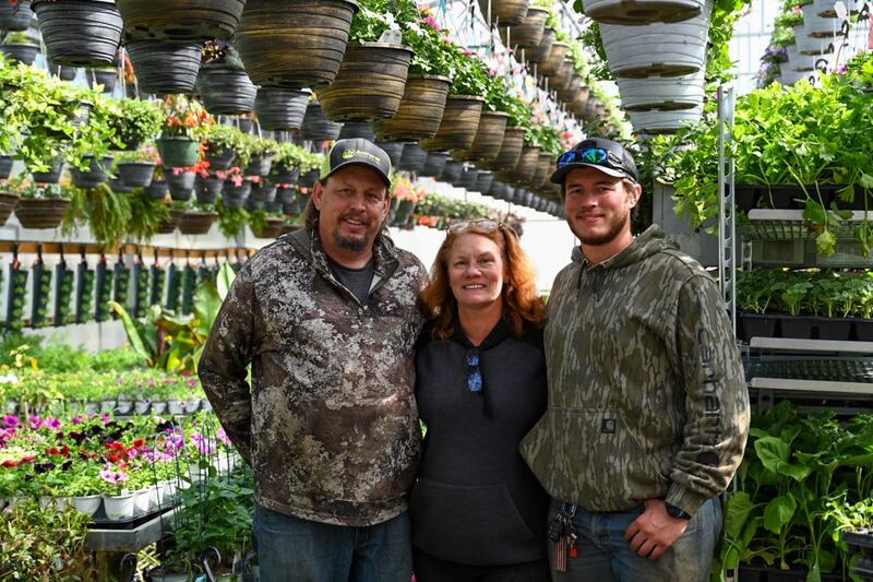 Brad and Karen Bothwell and son Dylan are inside one of their greenhouses. Farm stand season is in full swing for Bothwell Farms. (2024 image provided in 2025)