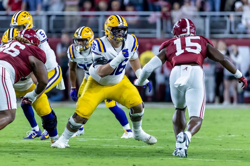 LSU offensive lineman Will Campbell (66) faces off against Alabama linebacker Dallas Turner (15) during the first half of an NCAA college football game, Saturday, Nov. 4, 2023, in Tuscaloosa, Ala. (AP Photo/Vasha Hunt, File)