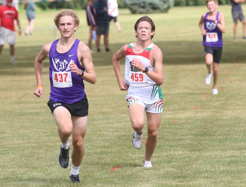 Dixon's Jaron Greve pulls ahead of L-P's Gianni Verucchi to take third place during the Gary Coates Invitational cross country meet on Saturday, Sept. 13, 2025 at Zearing Park in Princeton .