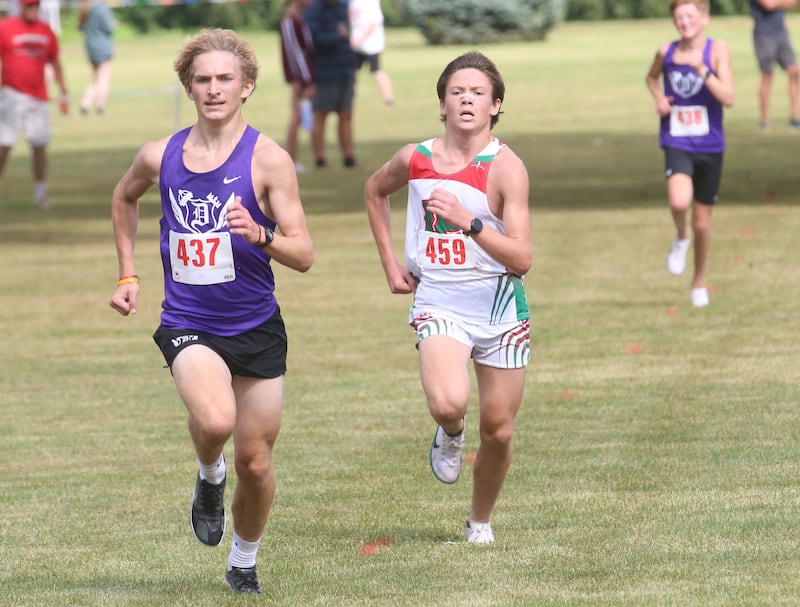 Dixon's Jaron Greve pulls ahead of L-P's Gianni Verucchi to take third place during the Gary Coates Invitational cross country meet on Saturday, Sept. 13, 2025 at Zearing Park in Princeton .
