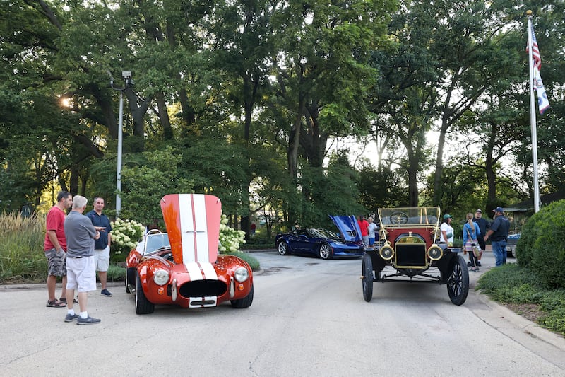 A 1912 Fort Model T, right, owned by Dave Szumowski, of Monee, and a 1965 Factory Five Cobra replica, left, owned by Dan Hall, of Kankakee, were two of many cars on display during the Cruise-In Night at the Museum on Thursday, Aug. 14, 2025.