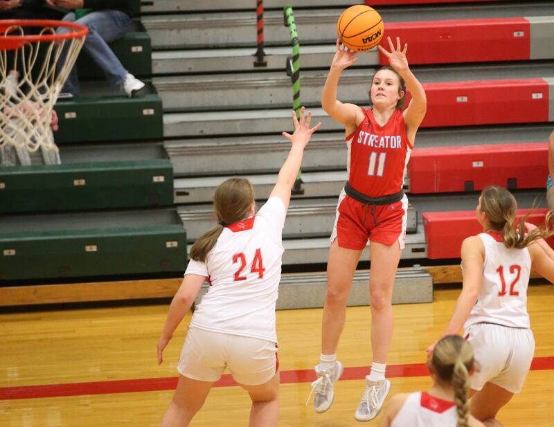 Streator's Ava Gwaltney shoots a jump shot over L-P's Madilyn Knowles in a game this past season at Sellett Gymnasium at L-P High School.