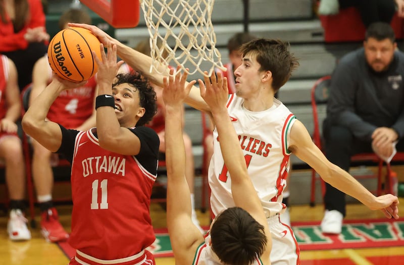 Ottawa's Hezekiah Joachim has his shot blocked by L-P's Wyatt Kilday on Friday, Jan. 9, 2026 in Sellett Gymnasium at L-P High School.