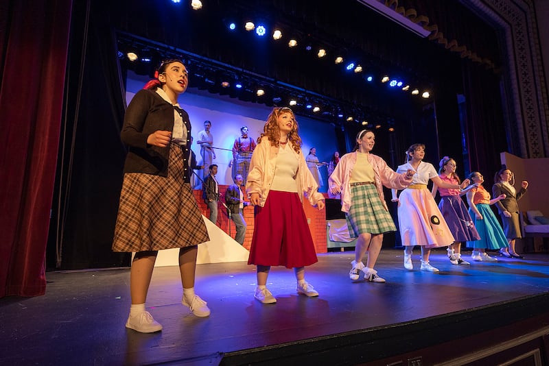 The cast of Dixon High School’s Grease rehearse their opening number Wednesday, March 12, 2025, at the school.