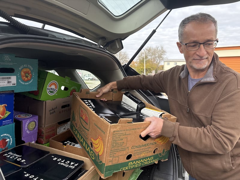 Mike Phillips unloads food at the Woodstock Food Pantry Oct. 31, 2025.