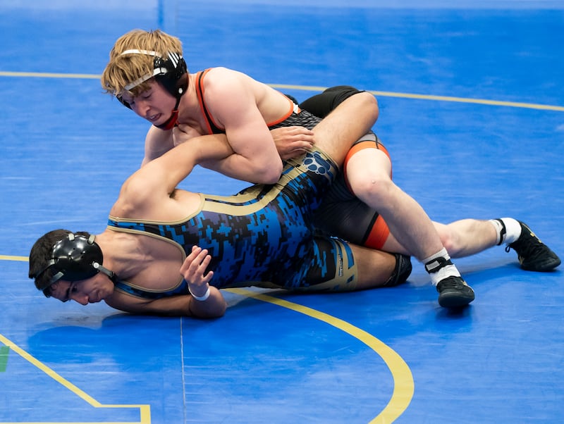 Crystal Lake Central's Dylan Ramsey, top, wrestles with Wheeling's Joey Romano in the 126 pound bout at the Class 2A Dual Team wrestling Sectional on Tuesday, February 25, 2025 at Wheeling High School. Ryan Rayburn for Shaw Local