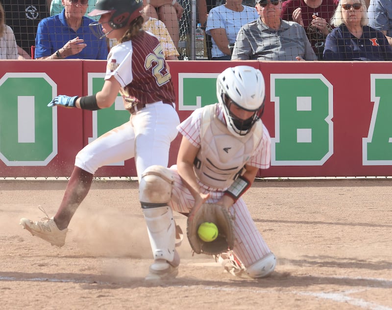 L-P catcher Mackenzie Chamberlain catches the ball at the plate as Dunlap's Hannah Parker scores a run during the Class 3A Sectional final on Friday, May 29, 2026 at the L-P Athletic Complex in La Salle.