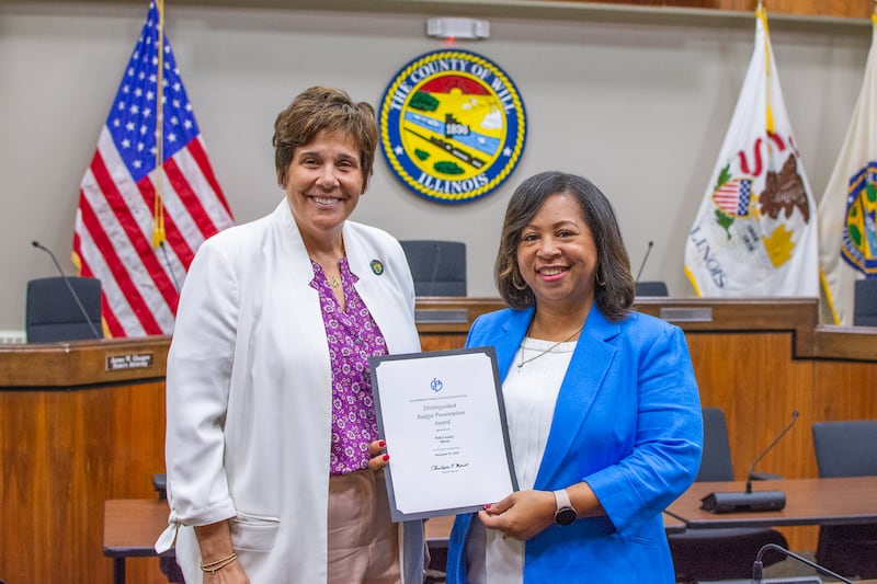 Will County Executive Jennifer Bertino-Tarrant and Budget Director ReShawn
Howard pose for a photo with the Distinguished Budget Presentation Award given to the county by the Government Finance Officers Association for their Fiscal Year 2025 Budget.