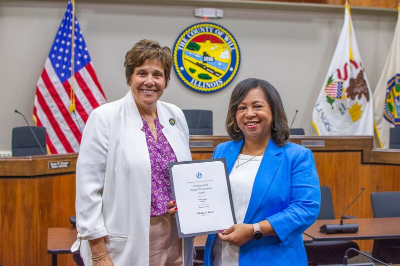 Will County Executive Jennifer Bertino-Tarrant and Budget Director ReShawn
Howard pose for a photo with the Distinguished Budget Presentation Award given to the county by the Government Finance Officers Association for their Fiscal Year 2025 Budget.