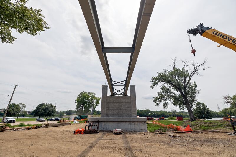 Construction on the Dixon pedestrian bridge continues Thursday, August 7, 2025, in Page Park. The city and park district are applying for a grant to enhance the bridge and market Petunia Fest.