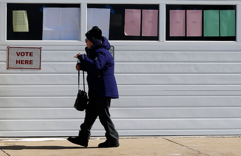 A voter walks into the Algonquin Township polling location on Tuesday, March, 17, 2026, to cast a ballot in the Illinois primary election.