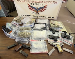 Two charged in Bureau County after cops seize guns, cocaine, cash
