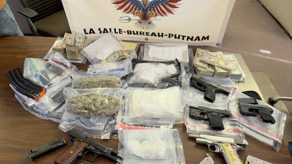 Two charged in Bureau County after cops seize guns, cocaine, cash