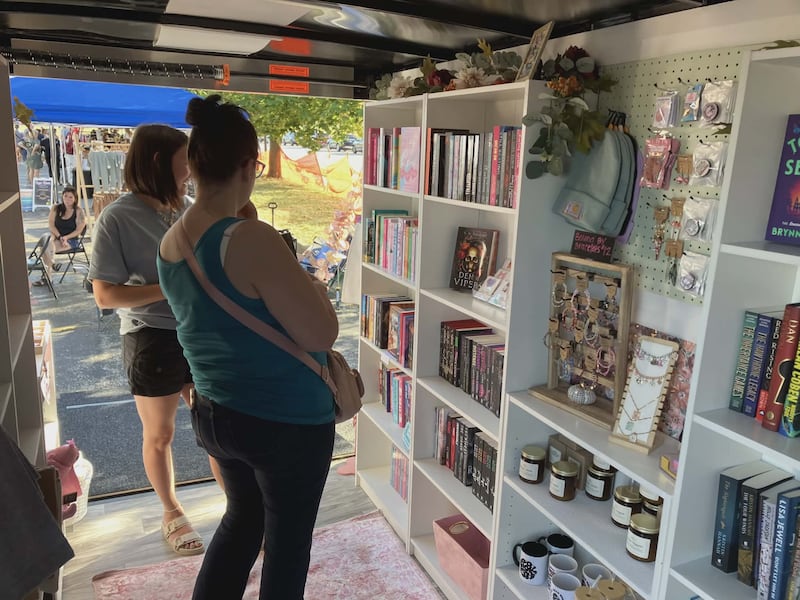 Customers peruse the shelves inside Cassi Hunn and Jacquee McLeod's mobile bookstore, Here for the Plot. The McHenry County friends started the business in September.