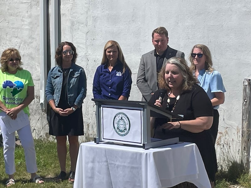 Annie Short, Mendota Project Director, presides over a Wednesday, June 12, 2024, press conference across from the Amtrak station in Mendota. There, a blighted property is to come down, to be replaced by a pavilion.