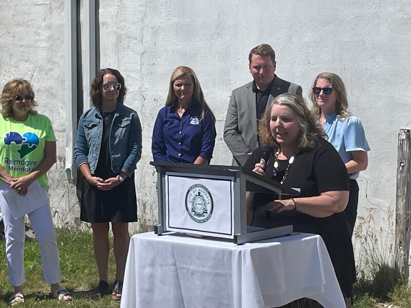 Annie Short, Mendota Project Director, presides over a Wednesday, June 12, 2024, press conference across from the Amtrak station in Mendota. There, a blighted property is to come down, to be replaced by a pavilion.