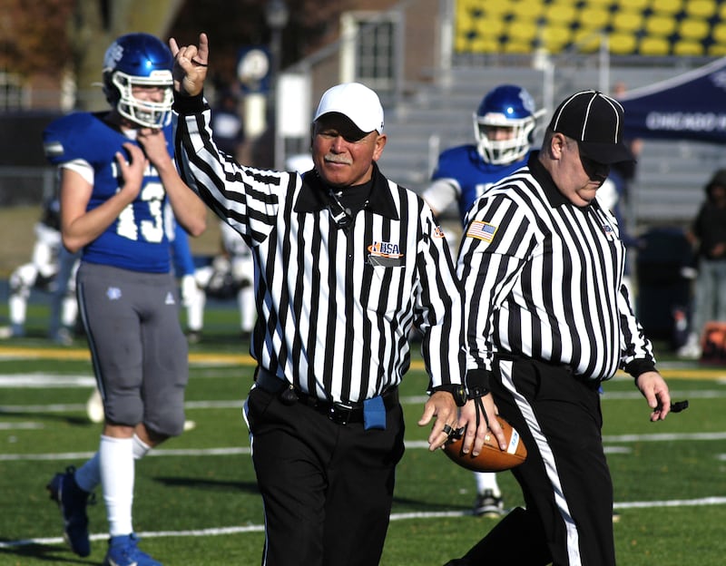 A referee signals a second down in a penalty filled game Saturday. Newman defeated Chicago Hope 50-22 in Class 1A 1st round football at Sterling High School on Saturday, November 2, 2024.