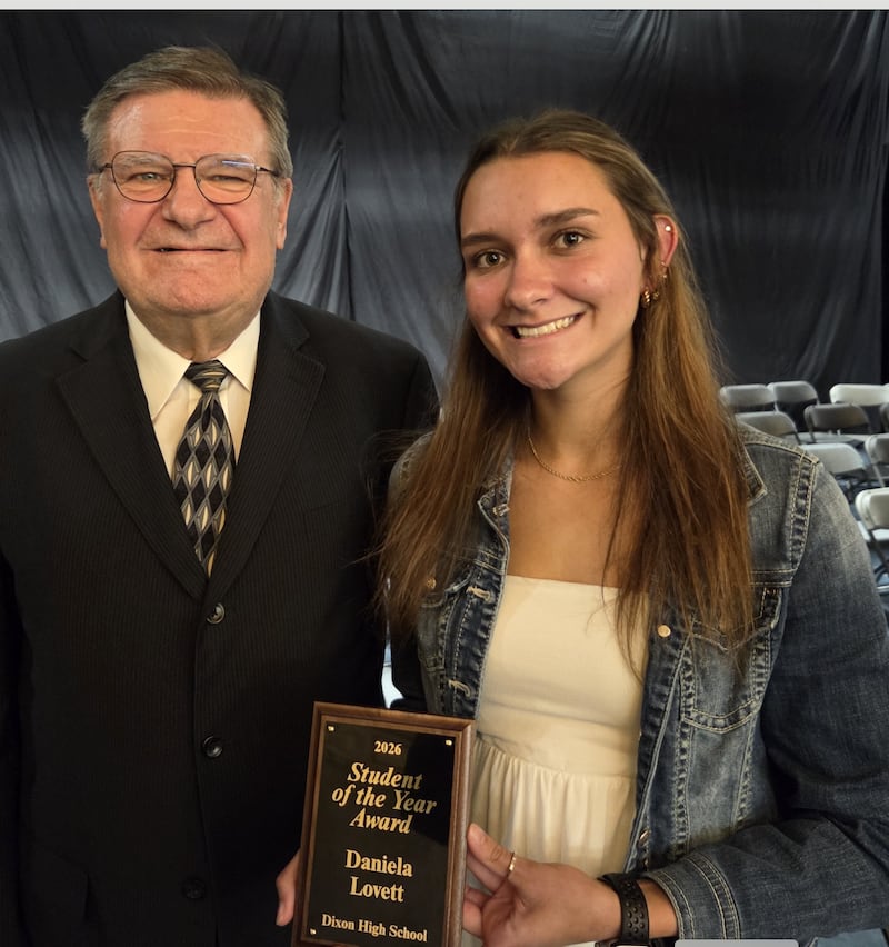 Dani Lovett (right) was presented with the Dixon High School Student of the Year Award on Wednesday night. She is pictured with Dixon Public Schools Foundation Vice President Geoff Vanderlin.