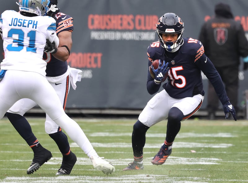 Chicago Bears wide receiver Rome Odunze follows the block of running back Roschon Johnson on Detroit Lions safety Kerby Joseph during their game Sunday, Dec. 22, 2024, at Soldier Field in Chicago.