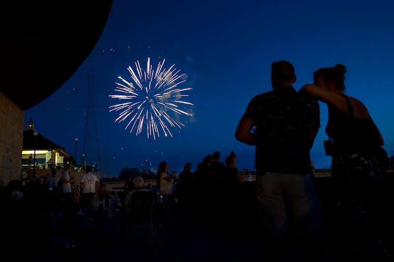 Spectators watch as fireworks illuminate the sky Monday, July 3, 2023 at Petunia Fest in Dixon. 90’s rock band Everclear finished off the weekend after the fireworks with a show on the main stage in downtown Dixon.