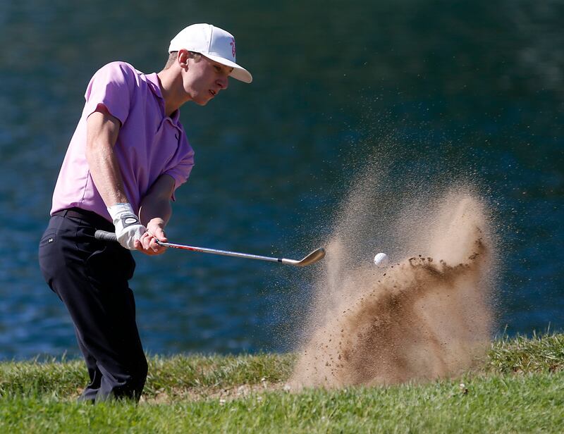 Hampshire’s Nolan Adamczyk hits out of the sand trap in the ninth green during the IHSA Class 3A Dundee-Crown Regional golf tournament on Wednesday, Oct. 2, 2024 at Randall Oaks Golf Club in West Dundee.