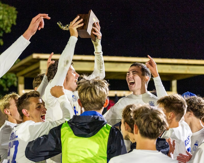 Players of Hinckley-Big Rock celebrate with trophy after winning the Little Ten Conference Championship match against Somonauk/Leland/Newark on Thursday, Oct. 9, 2025 at Hinckley-Big Rock School in Hinckley.