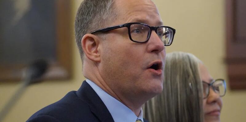 A.J. Wilhelmi, CEO of the Illinois Health and Hospital Association, testifies before a legislative committee in March about impending cuts in federal Medicaid spending.